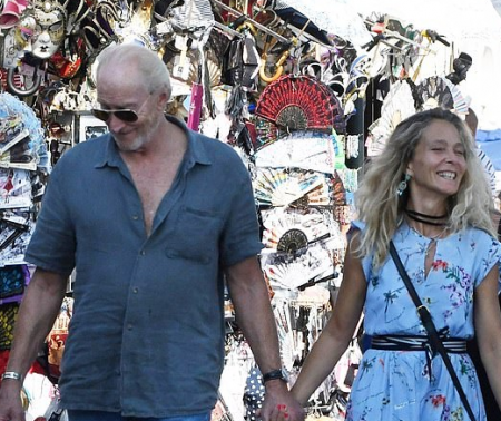 Charles Dance, 73, and his new Italian film maker sweetheart, 53, appreciate a sentimental walk around Venice after THAT hot kiss